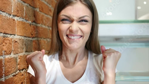 Positive Winning Woman Celebrating Success News at Home photo