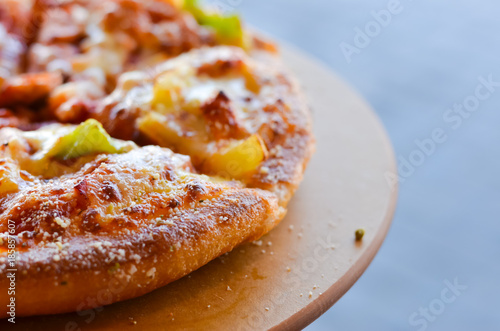 Hot pizza slice with  bell pepper vegetables delicious tasty fast food italian traditional on wooden board table classic,select focus.