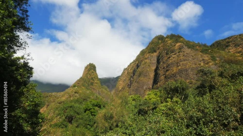 a wide shot time lapse of maui's iao needle photo