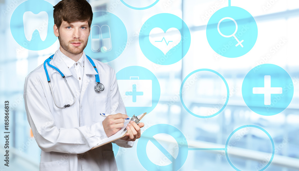 Young confident doctor man in medical gown Young confident doctor man in medical gown
