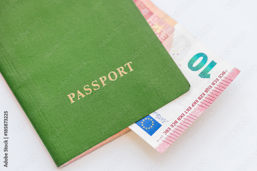 10 euros in the green passport on a white background, close-up 10 euros in the green passport on a white background, close-up