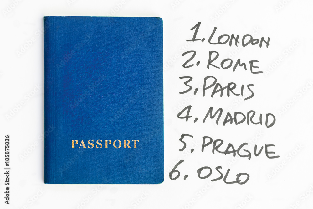 Blue passport next to the list of European cities Blue passport next to the list of European cities