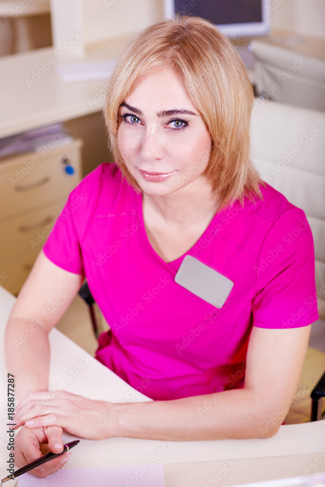 Female doctor sitting at the table