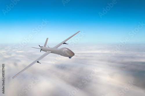 Unmanned military aircraft fly high speed background blue sky clouds.