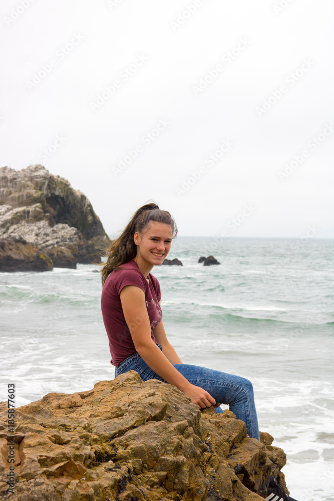 San francisco beach waves water and fun you must visit during your vacation in America teen girl has fun on the beach