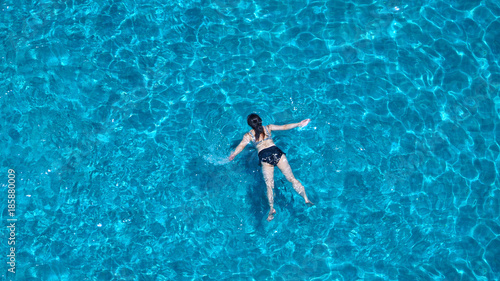 People swimming in the hotel pool on summer day © gnepphoto