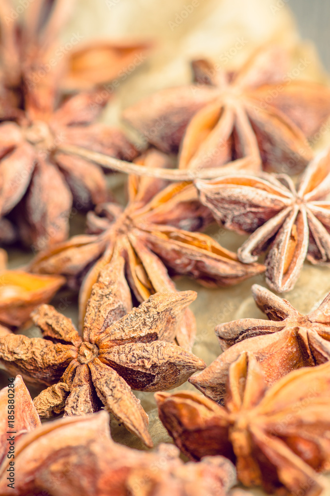 Anise stars on the rustic wooden background. Selective focus. Shallow depth of field. Anise stars on the rustic wooden background. Selective focus. Shallow depth of field.