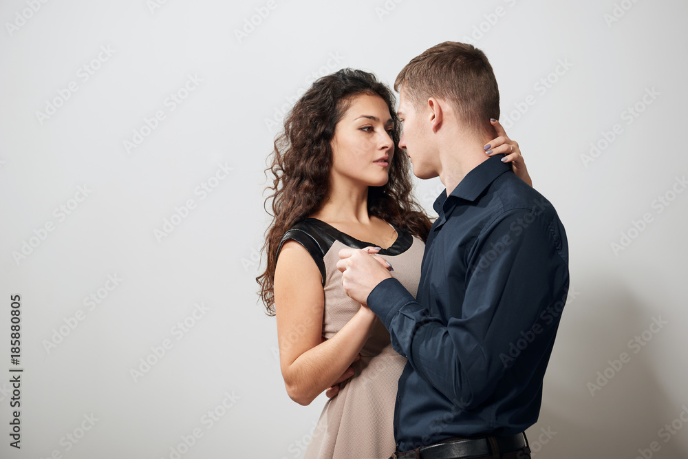 Portrait of young couple posing on white background Portrait of young couple posing on white background