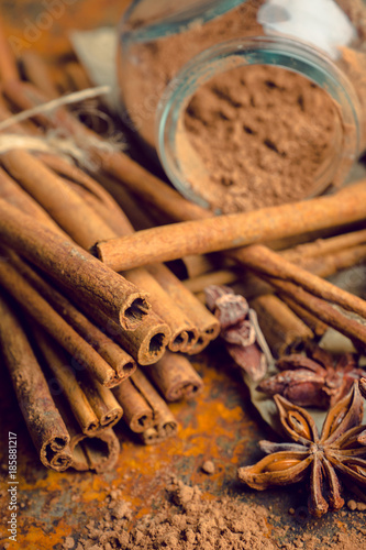 Cinnamon sticks on the rustic wooden background. Selective focus. Shallow depth of field.