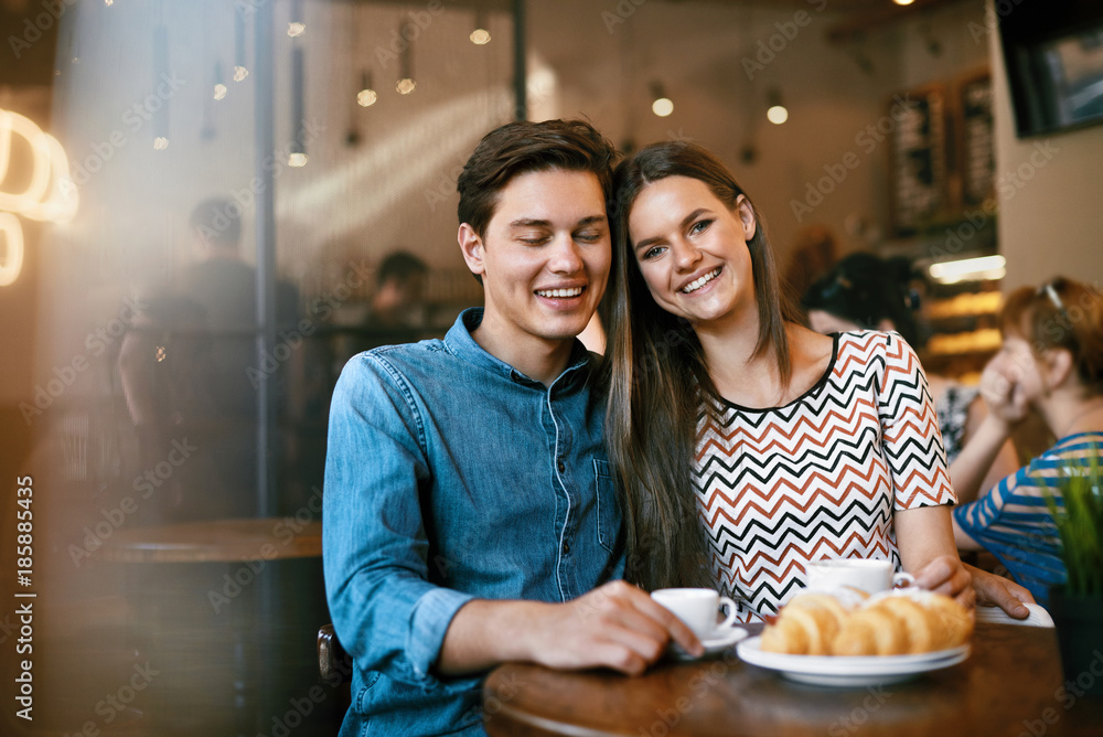 Couple With Coffee On Date. Beautiful Smiling People
