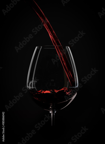 Wine splashes on black background