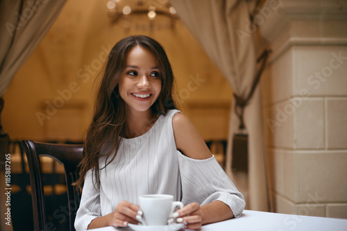 Woman In Cafe. Beautiful Female With Coffee In Restaurant.