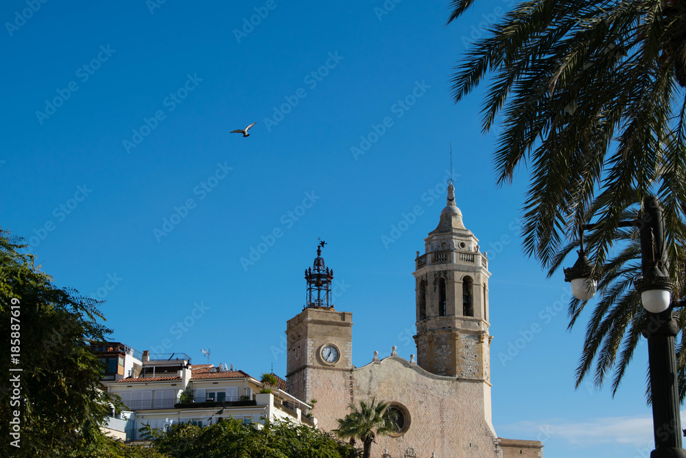 The beautiful town of Sitges with seagulls, winter Spain, Parròquia de Sant Bartomeu i Santa Tecla 