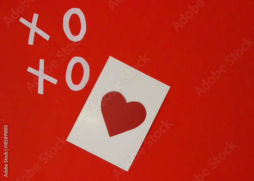 A card with a picture in the form of a heart and an inscription hoho on a red background