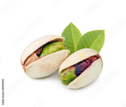 Pistachios whith lleaf isolated on white background