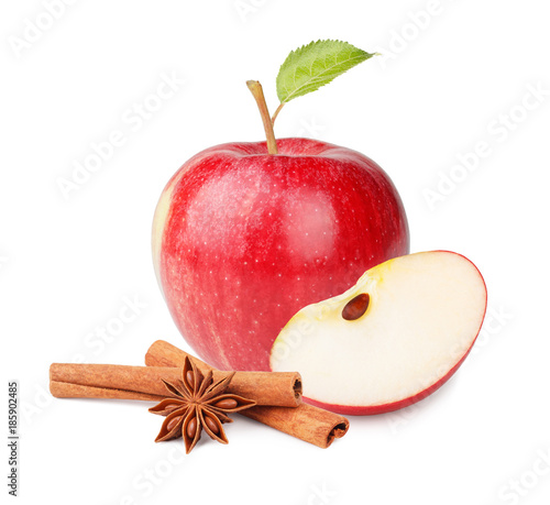 Fresh red apple with leaves and cinnamon sticks isolated on white background as package design element