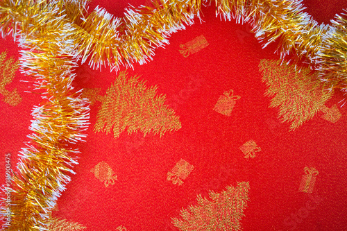 New Year's holiday fabric, red fabric with golden trees photo