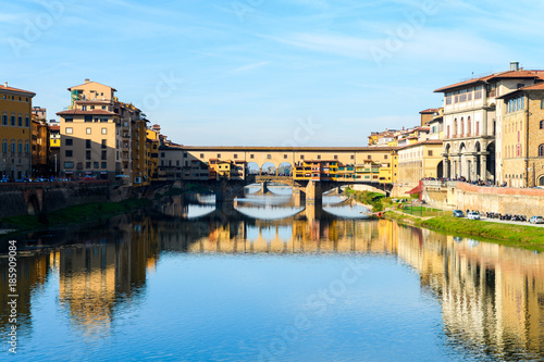 famous ponte vecchio bridge of florence on sunny day © jon_chica