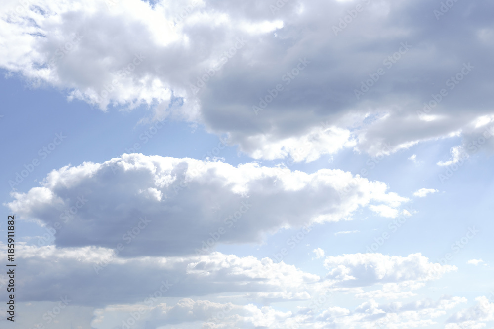 blue sky background with tiny clouds