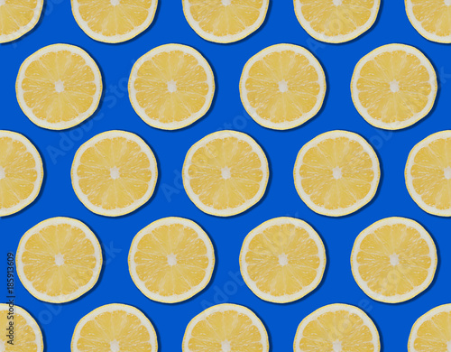 Yellow lemon slices design blue background.