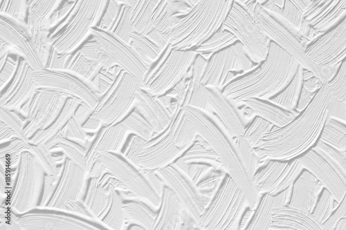 A white background with a texture of the plaster. Surface of the wall with a pattern of strips.