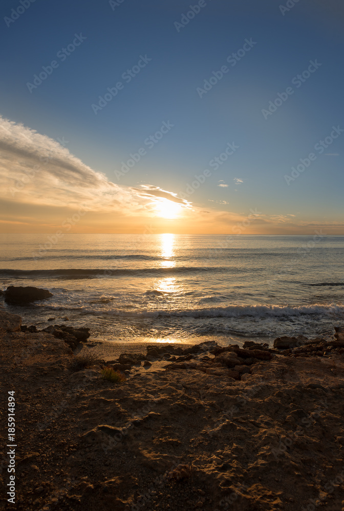 The calm sea in a very cloudy sunset The calm sea in a very cloudy sunset