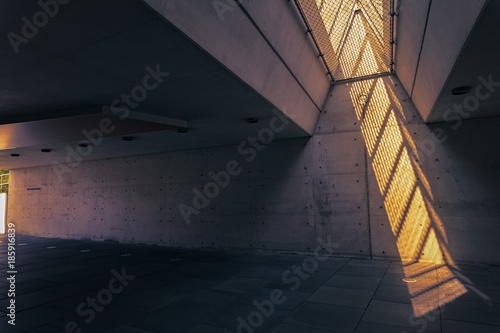 sun light shines though glass into an underpass photo