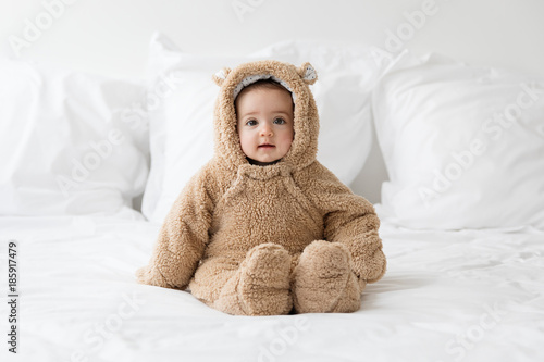 cute baby wearing bear suit