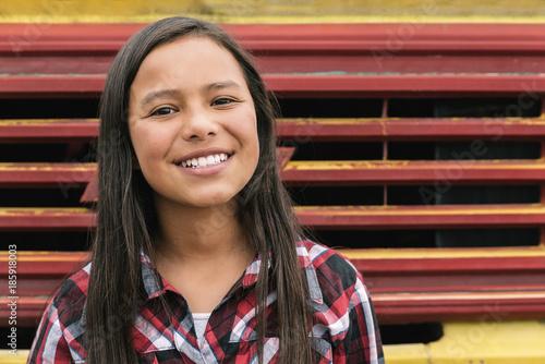 Portrait of beautiful latino girl in the street.