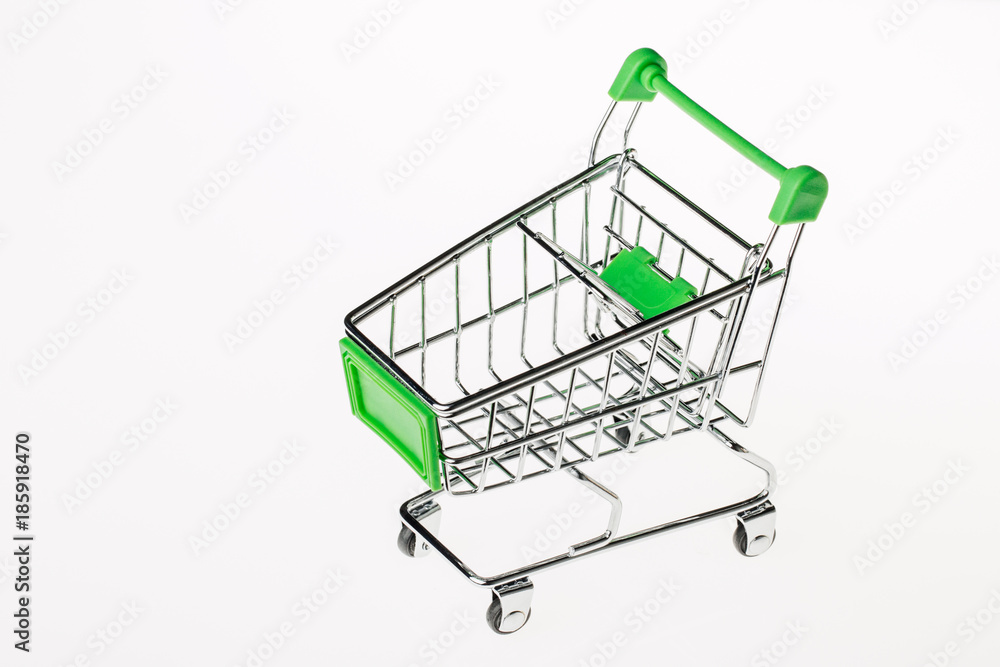 Small metal shopping cart isolated on white background Small metal shopping cart isolated on white background