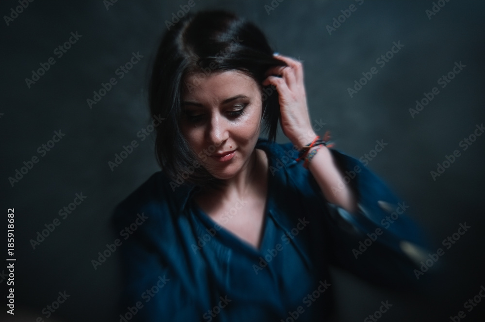 Beautiful brunete women portrait in studio on dark background Beautiful brunete women portrait in studio on dark background