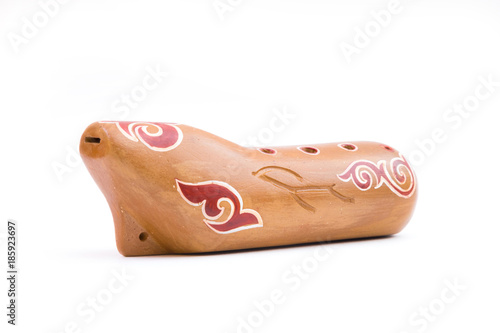 Kazakh traditional sazsyrnai. 
Closeup of a sazsyrnay - kazakh traditional ocarina isolated on white background photo