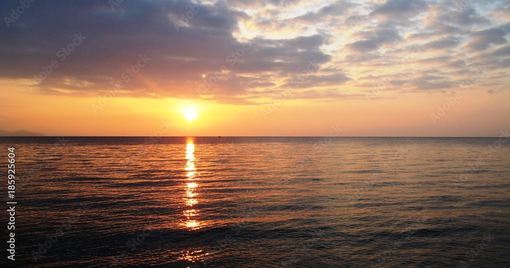 Sun rising over the sea, Greece