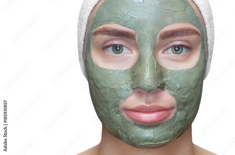 The procedure for applying a mask from clay to the face of a beautiful woman. Spa treatments and care of the cats in the beauty salon. The procedure for applying a mask from clay to the face of a beautiful woman. Spa treatments and care of the cats in the beauty salon.