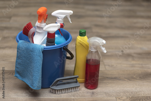 Schilderij op canvas Cleaning products, household chemicals, rags, sponges, brushes, blue bucket, for cleaning the apartment and office
