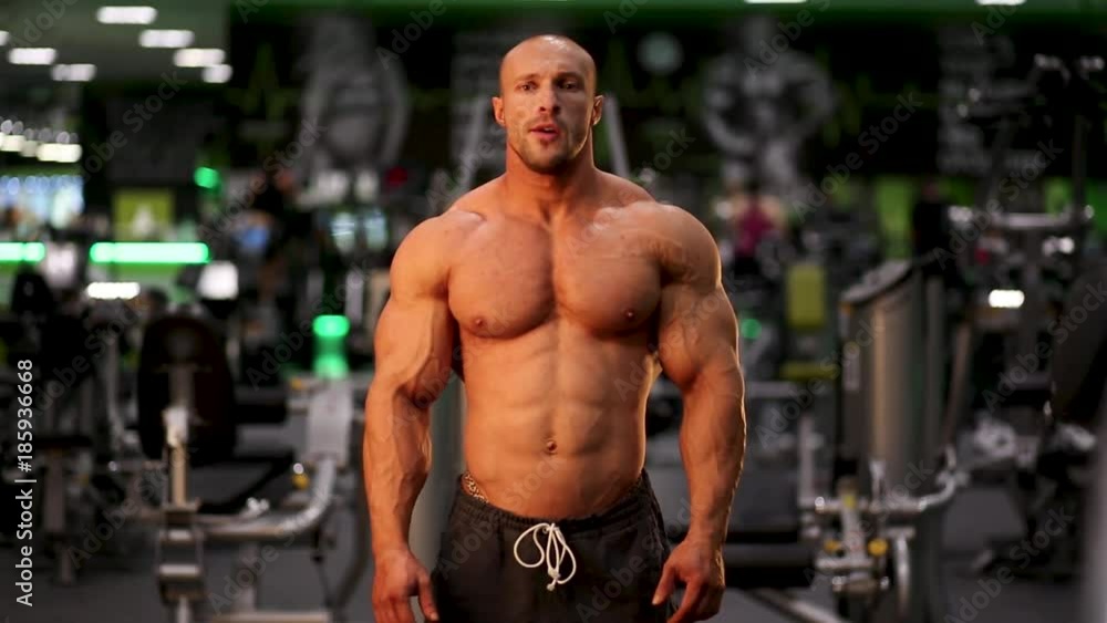 bodybuilder posing in gym bodybuilder posing in gym