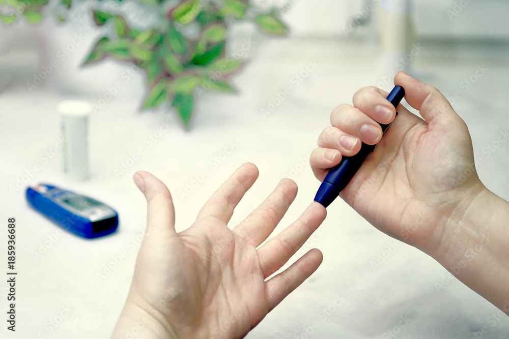 A medical test, checking a drop of blood on the sugar level. A medical test, checking a drop of blood on the sugar level.