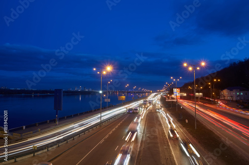 Motion picture in Kiev at night in the sunset. Kind of traffic on a busy street at sunset - the image has soft focus.