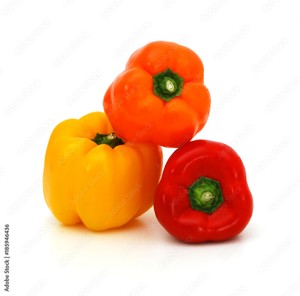 Fresh yellow, red and orangebell peppers isolated on white Fresh yellow, red and orangebell peppers isolated on white