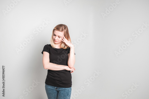 Beautiful young woman holding head in pain © anniebrusnika