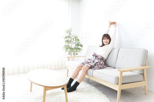 Young woman being relaxed in room