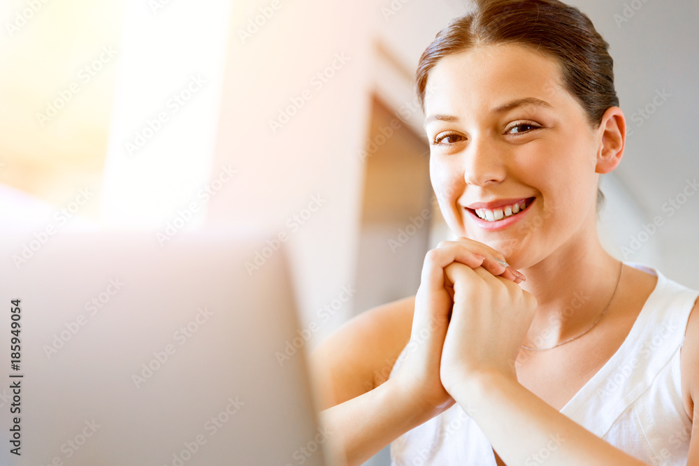 Young beautiful woman working on her laptop Young beautiful woman working on her laptop