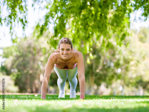 Young woman exercising in the park