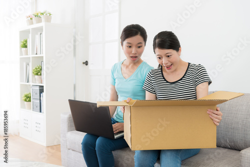 surprised pretty women received shipping parcel