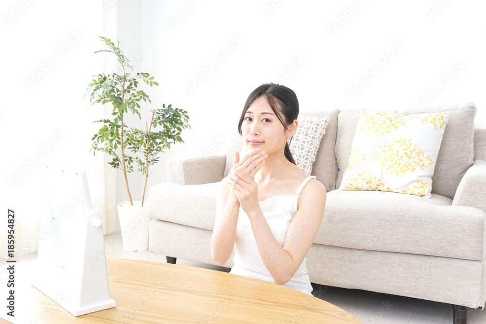 Young woman applying a cream Young woman applying a cream
