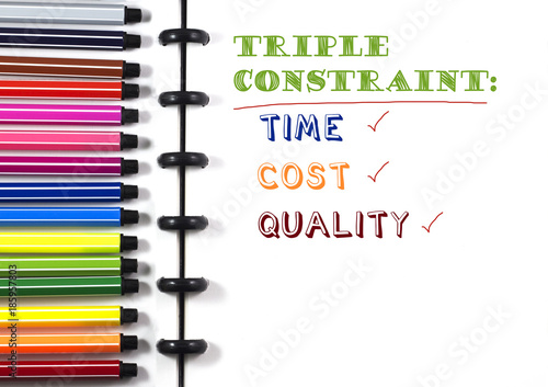 Project Management Triple constraint text on white sketchbook with color pen, top view photo