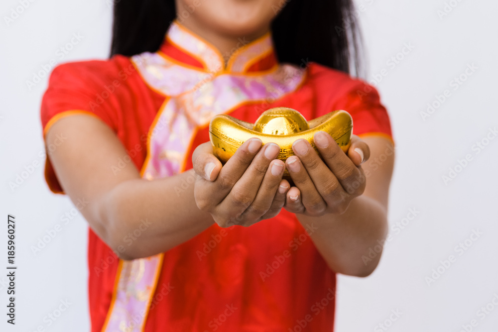 Asian woman with cheongsam holding gold. Chinese new year.