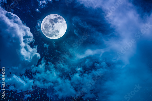 Night sky with bright full moon and cloudy, serenity nature background. © kdshutterman