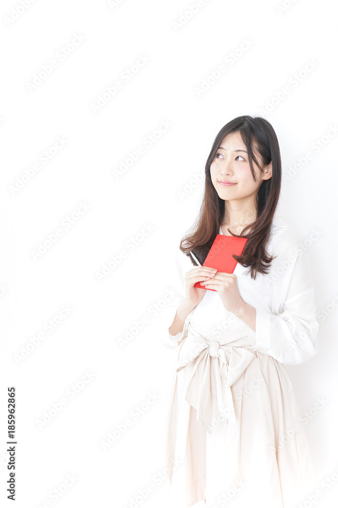 Young woman taking memos