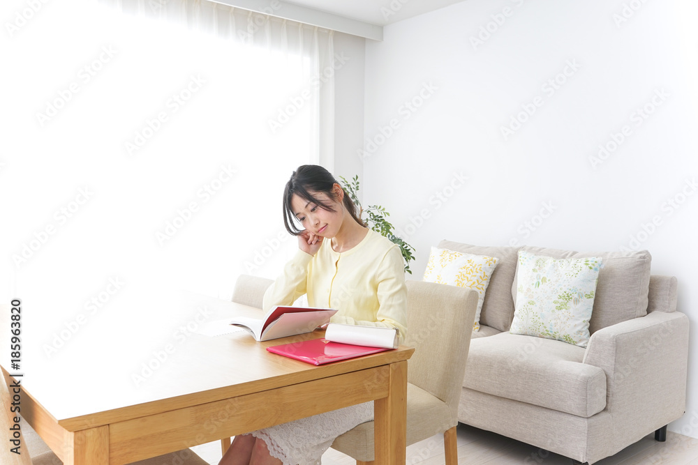 Female student studying for an entrance exam at home Female student studying for an entrance exam at home